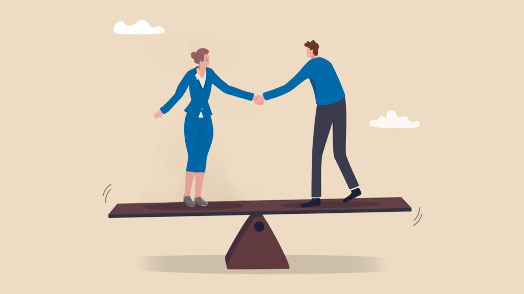 Two colleagues shaking hands on a balance seesaw